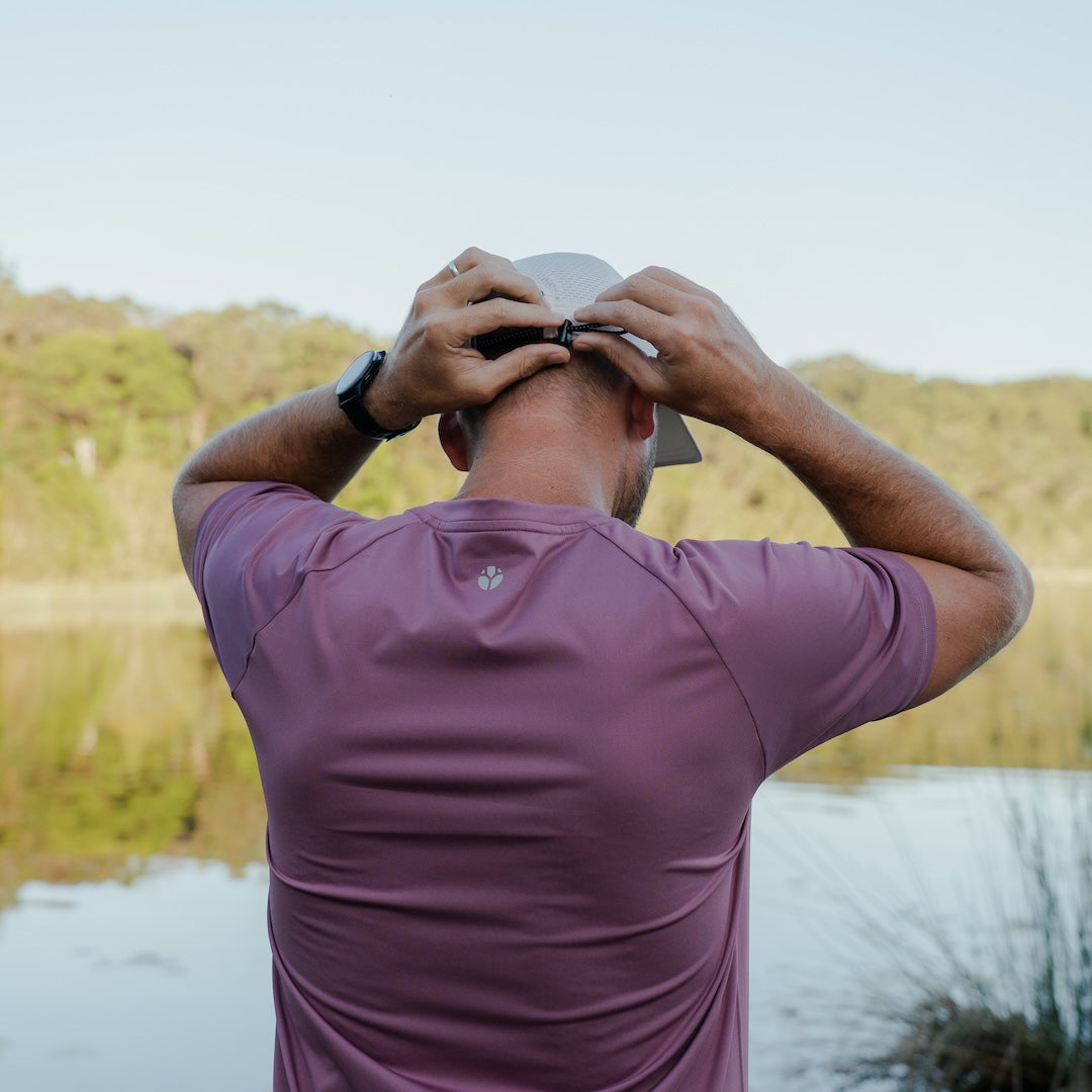 Runner wearing CP-SHORELINE Running Cap outdoors
