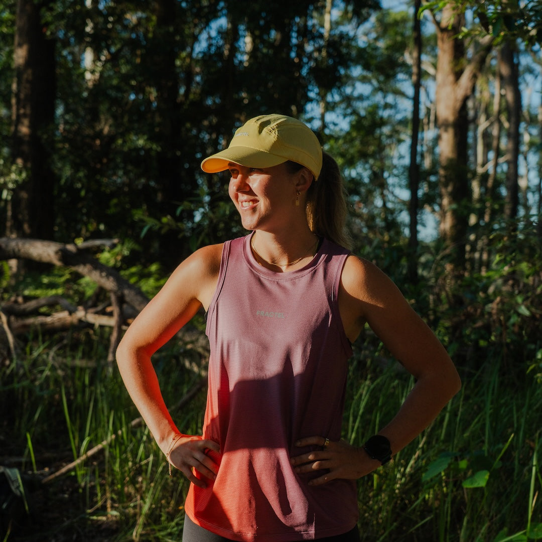 Runner wearing E-ALBA Cap outdoors