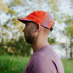 Runner wearing M-EMBER Running Cap outdoors
