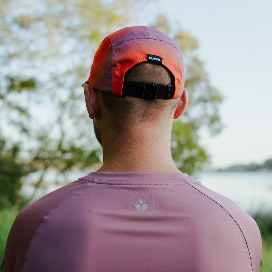 Runner wearing Fractel Ember Running Cap, lifestyle
