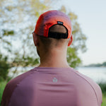 Runner wearing Fractel Ember Running Cap, lifestyle