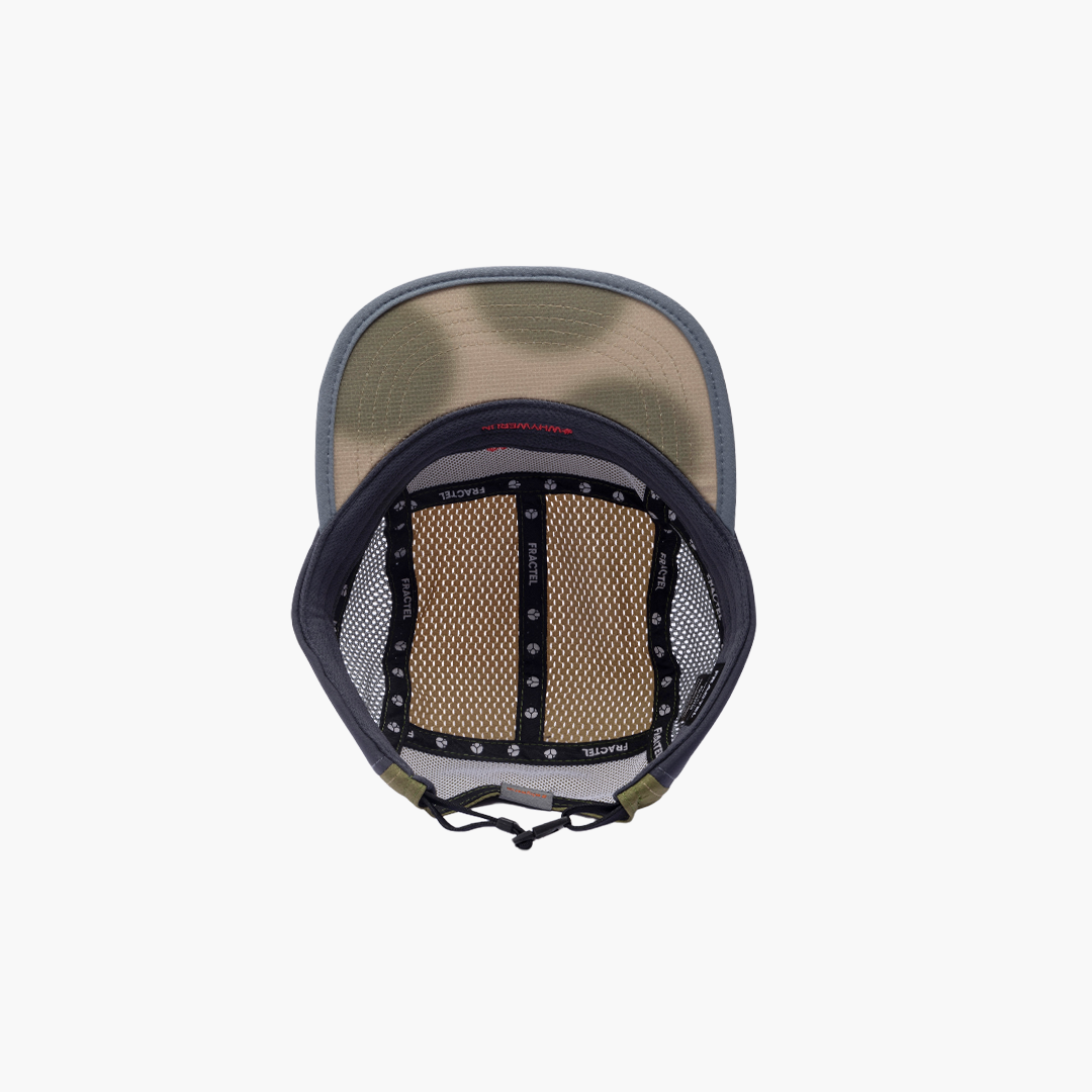 Back view of a cap with mesh design on a white background