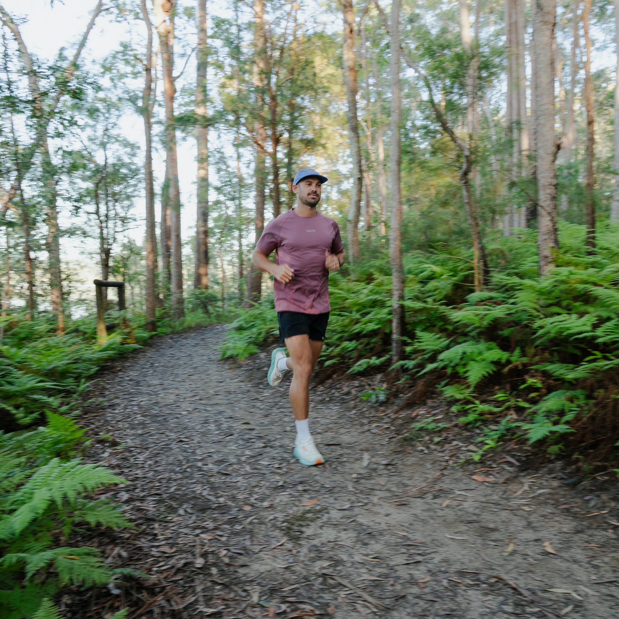 Runner wearing Men's S-AURA Running Shirt outdoors