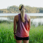 Runner wearing Women's S-EMBER Running Singlet outdoors